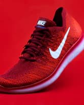 colorful background, shopify product research, winning product example, red athletic sneakers, trending footwear discovery
