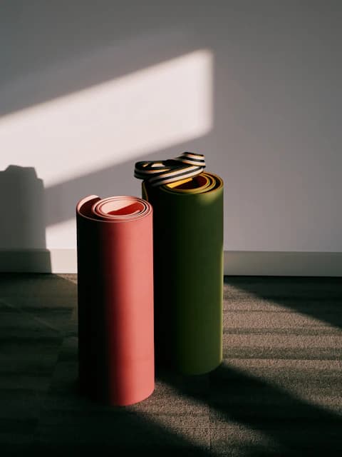 soft light, rolled yoga mats against wall, high demand fitness products, find trending gear to sell, sports niche product discovery, storelister